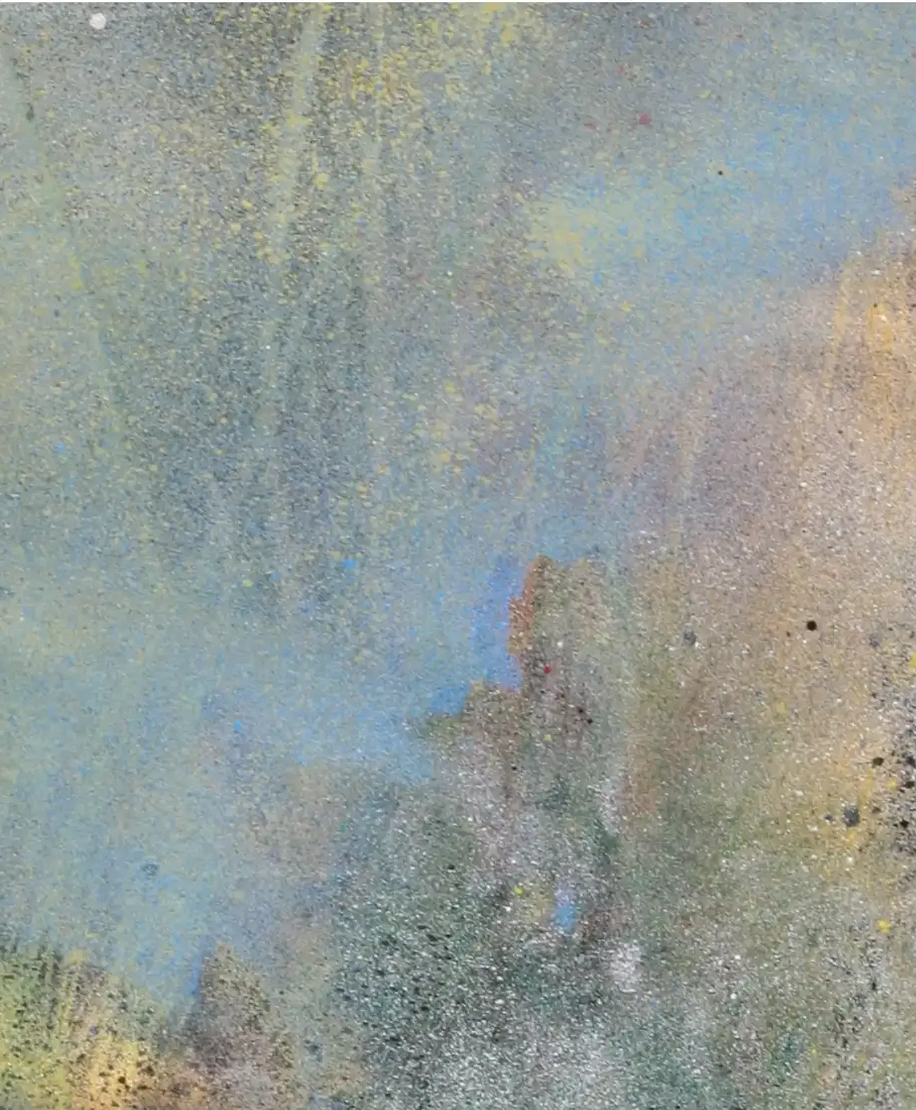 A spray paint artwork featuring an interplay of blue and ochre tones. (3)